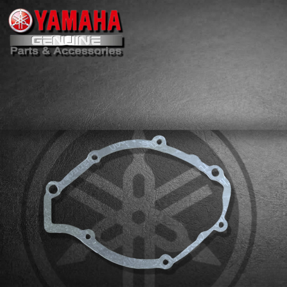 EMPAQUE TAPA IZQ./ CORONILLA YAMAHA YBR125 (SUZ)