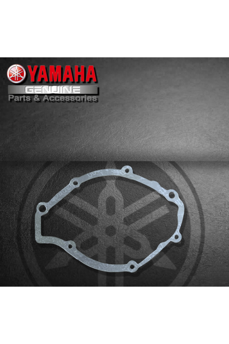 EMPAQUE TAPA IZQ./ CORONILLA YAMAHA YBR125 (SUZ)
